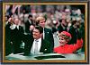 100 for the giper 
Jan. 20, 1981 photo, shows President Ronald Reagan as he gives a thumbs up to the crowd while his wife, first lady Nancy Reagan,...