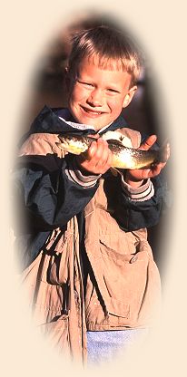 https://www.flyanglersonline.com/alcampbell/boywithfish.jpg