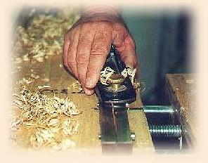 Bob using a hand plan and planing form