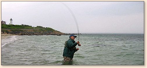 Dave Micus casting, Woods Hole Light in the background