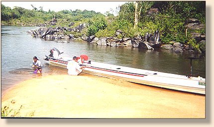 The longboat �voadeira� stops in a Xingu beach for a quick 'dip' to cool off.