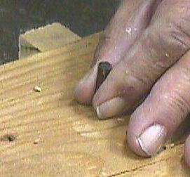 Positioning the sharpened piece of cane blank